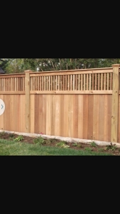 Vertical Lockboard Privacy Fence with Decorative Picket Top Rail